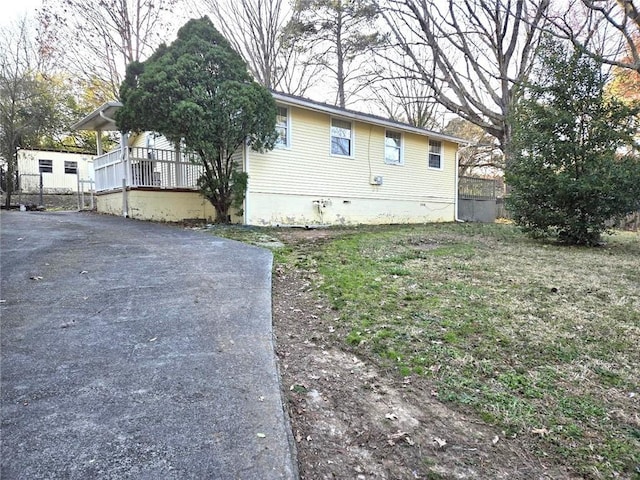 view of side of home featuring crawl space