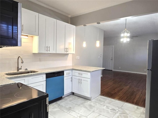 kitchen with dishwasher, a peninsula, freestanding refrigerator, electric range, and a sink