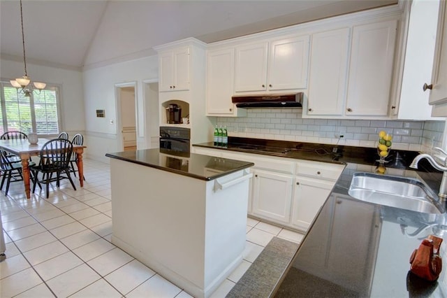 kitchen featuring under cabinet range hood, a sink, black appliances, light tile patterned floors, and a kitchen island