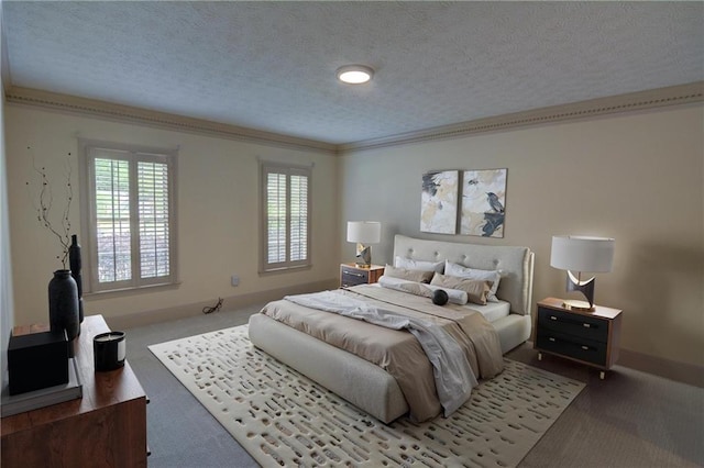 bedroom featuring carpet, a textured ceiling, ornamental molding, and baseboards