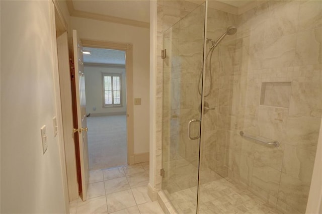 full bath with a shower stall, ornamental molding, and baseboards