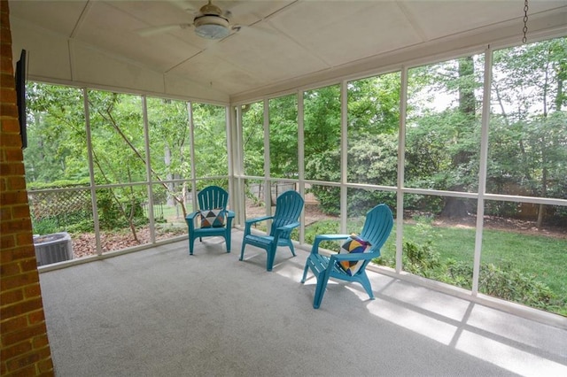 unfurnished sunroom with ceiling fan and lofted ceiling