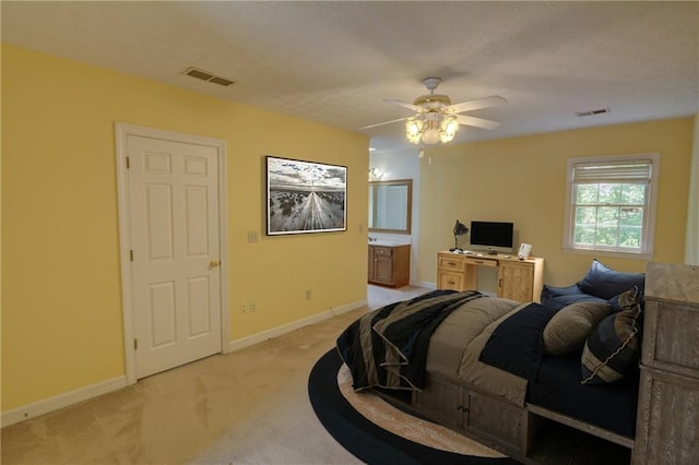 bedroom featuring light carpet, baseboards, and ceiling fan