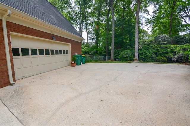 garage featuring driveway