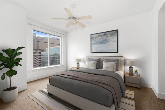 bedroom with light carpet and ceiling fan