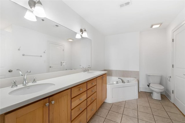 bathroom featuring tile patterned floors, toilet, and vanity