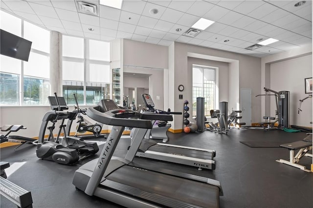 gym featuring a paneled ceiling