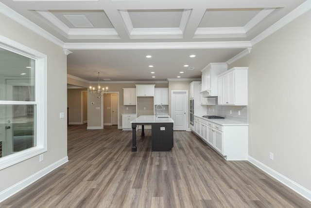 5587 Spring St, Flowery Branch, GA 30542 - kitchen with backsplash, dark wood-style flooring, a sink, a chandelier, and white cabinetry