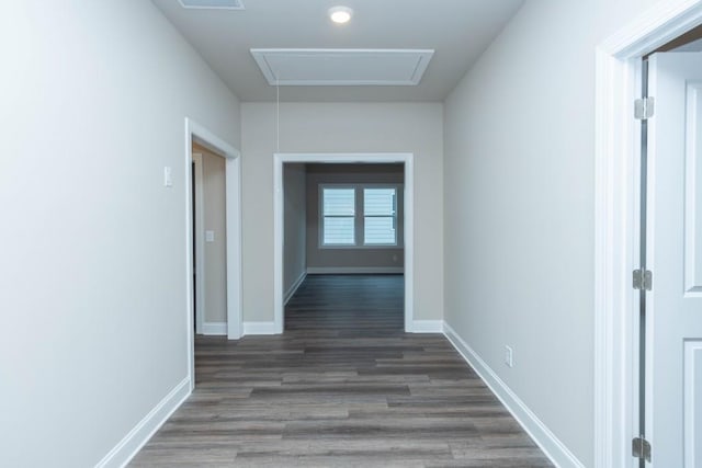 5587 Spring St, Flowery Branch, GA 30542 - hallway with dark wood-style flooring, baseboards, visible vents, and attic access