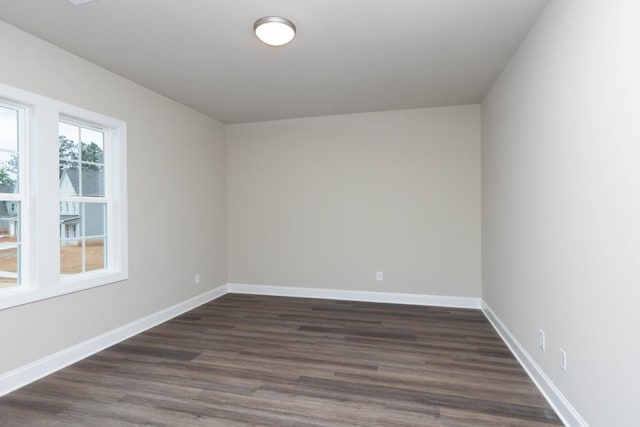 5587 Spring St, Flowery Branch, GA 30542 - unfurnished room with dark wood-type flooring and baseboards