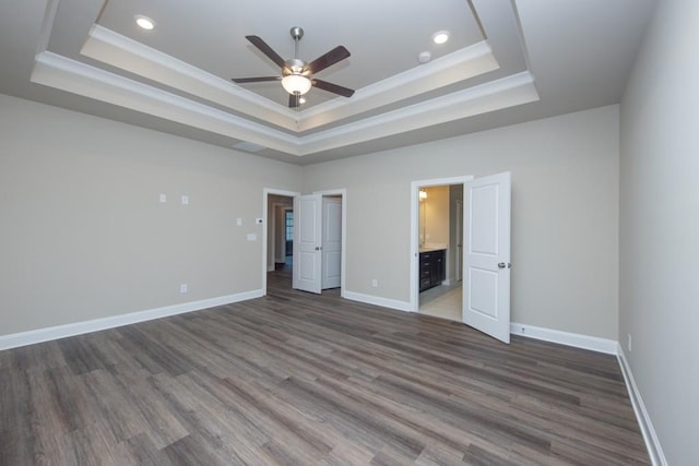 5587 Spring St, Flowery Branch, GA 30542 - unfurnished bedroom featuring recessed lighting, baseboards, a raised ceiling, and wood finished floors