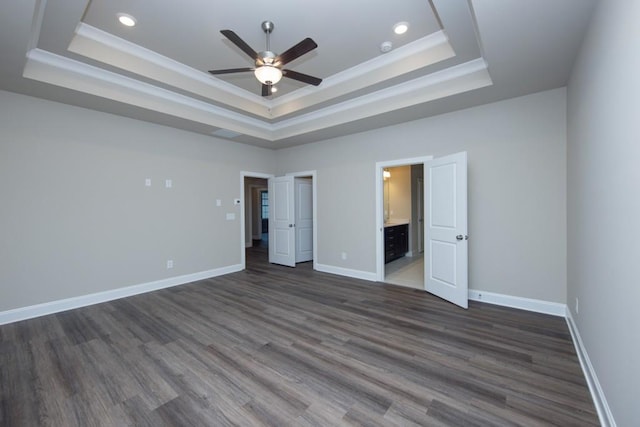 5587 Spring St, Flowery Branch, GA 30542 - unfurnished bedroom with recessed lighting, dark wood finished floors, and a tray ceiling