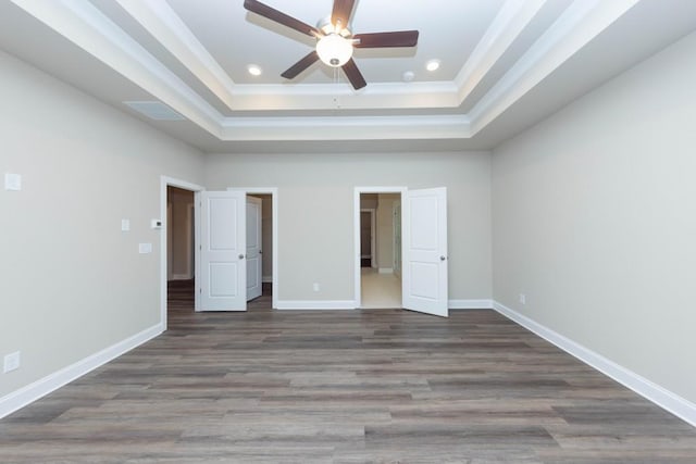 5587 Spring St, Flowery Branch, GA 30542 - unfurnished bedroom with recessed lighting, baseboards, wood finished floors, and a raised ceiling