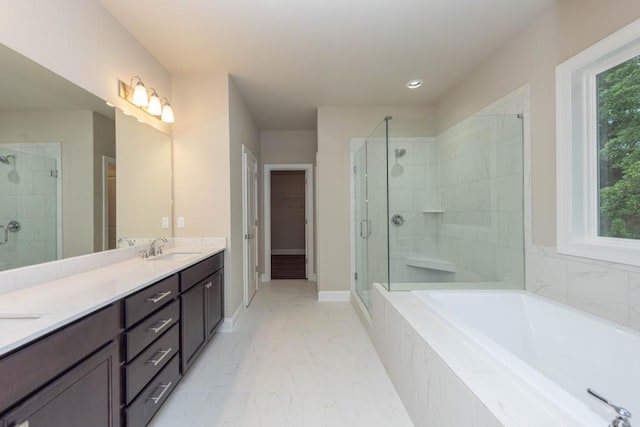 5587 Spring St, Flowery Branch, GA 30542 - full bathroom featuring double vanity, marble finish floor, a bath, a shower stall, and a sink