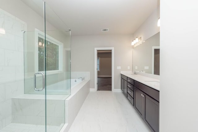 5587 Spring St, Flowery Branch, GA 30542 - bathroom featuring double vanity, marble finish floor, visible vents, a bath, and a stall shower