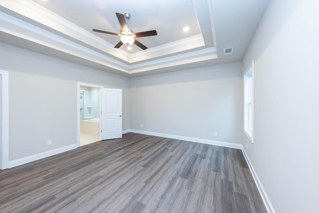 5587 Spring St, Flowery Branch, GA 30542 - unfurnished room featuring a ceiling fan, a tray ceiling, visible vents, and wood finished floors