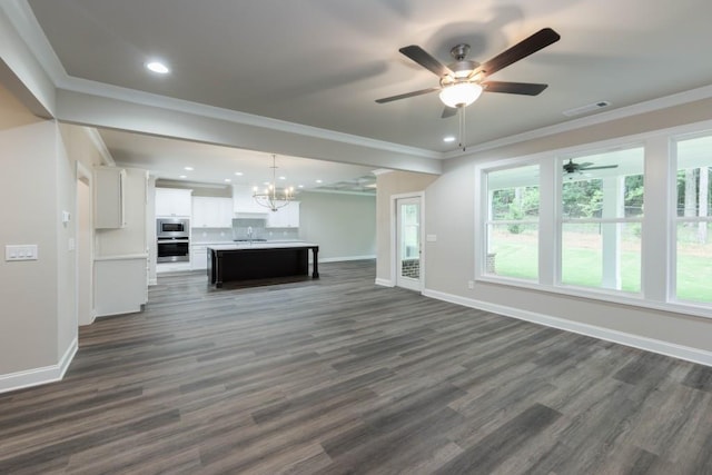 5587 Spring St, Flowery Branch, GA 30542 - unfurnished living room with visible vents, crown molding, baseboards, and ceiling fan with notable chandelier