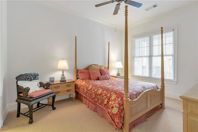 carpeted bedroom featuring ceiling fan, crown molding, and multiple windows