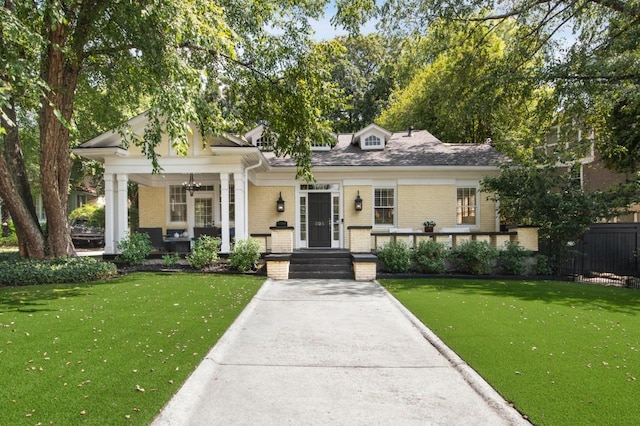 view of front facade with a porch and a front yard