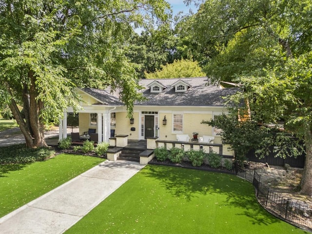 view of front of home featuring a front yard and a porch