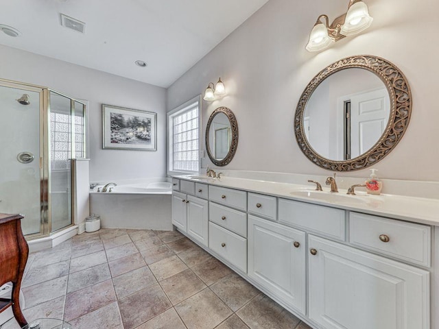 bathroom featuring vanity and plus walk in shower