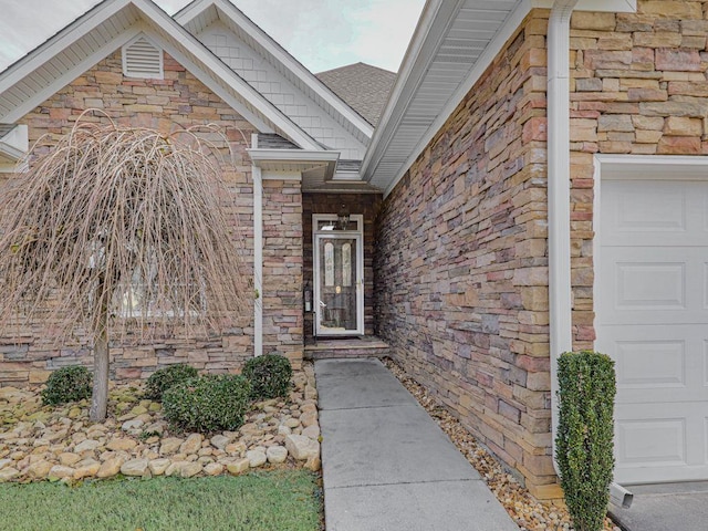 entrance to property featuring a garage