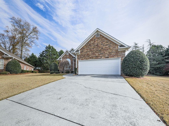 view of front property with a garage and a front yard