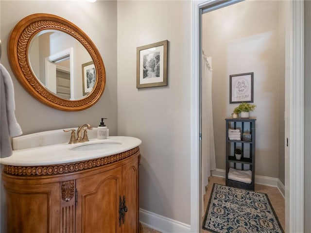 bathroom with tile patterned floors and vanity