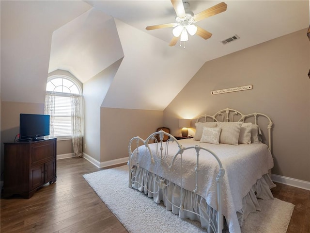 bedroom with ceiling fan, dark hardwood / wood-style flooring, and lofted ceiling