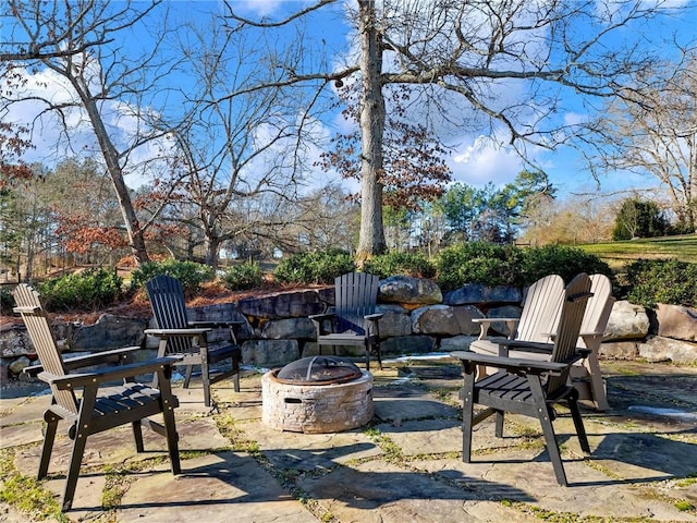 view of patio with an outdoor fire pit