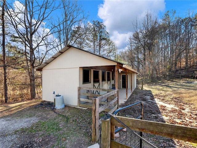 view of home's exterior featuring an outbuilding