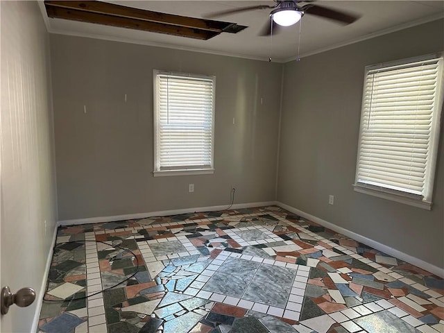 spare room with a wealth of natural light, ceiling fan, and ornamental molding