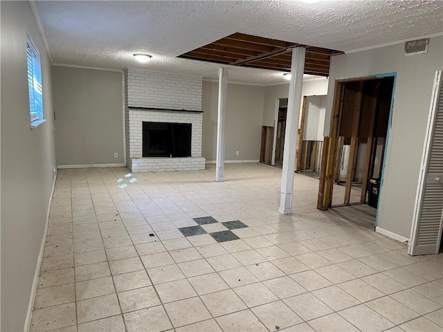 unfurnished living room featuring crown molding, a fireplace, and a textured ceiling