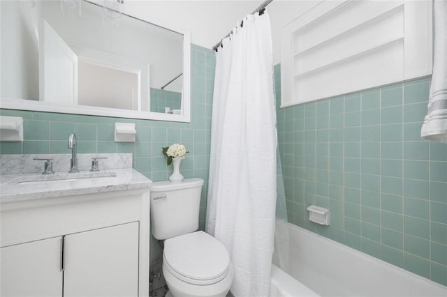 full bathroom featuring tile walls, toilet, shower / tub combo with curtain, tasteful backsplash, and large vanity