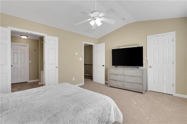 carpeted bedroom featuring ceiling fan, baseboards, and lofted ceiling