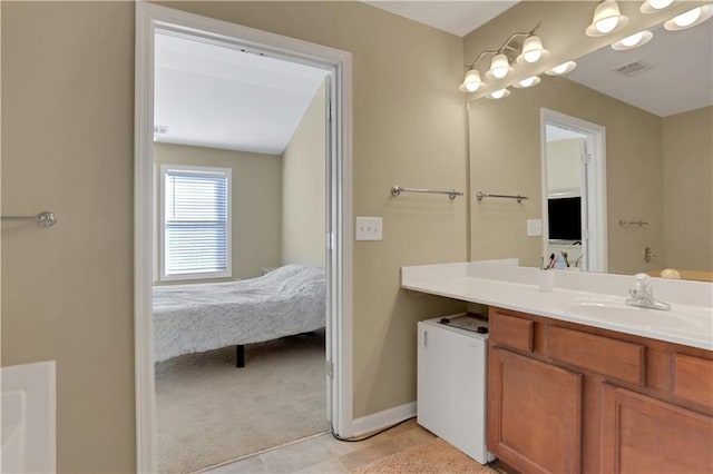 bathroom with visible vents, baseboards, connected bathroom, and vanity