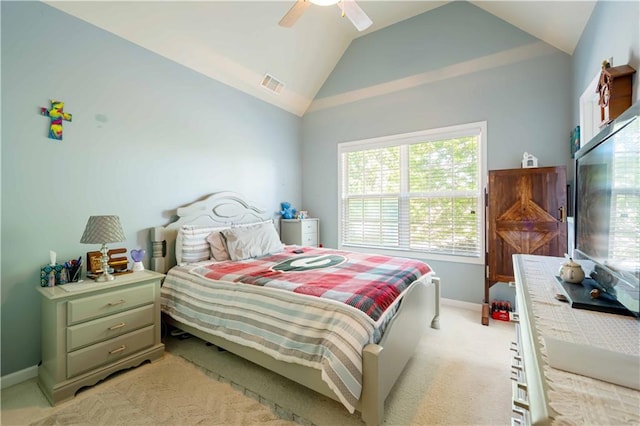 bedroom featuring lofted ceiling, baseboards, light carpet, and ceiling fan