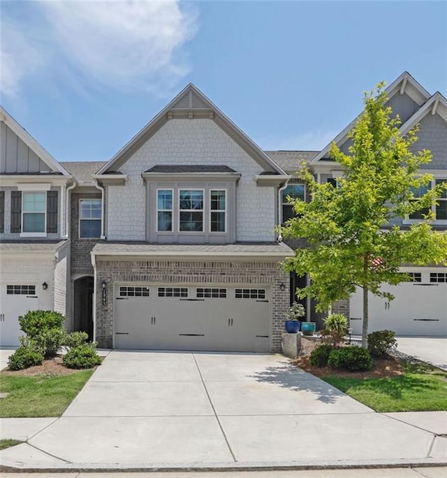 1969 Lanier Harbor Pt, Buford, GA 30518 - craftsman house with driveway, an attached garage, and board and batten siding