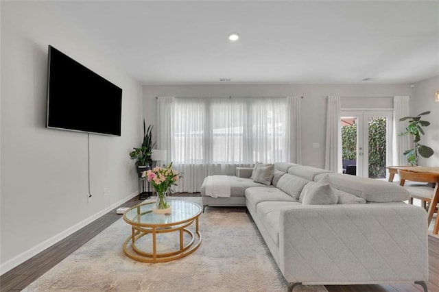 1969 Lanier Harbor Pt, Buford, GA 30518 - living area featuring wood finished floors, french doors, and recessed lighting