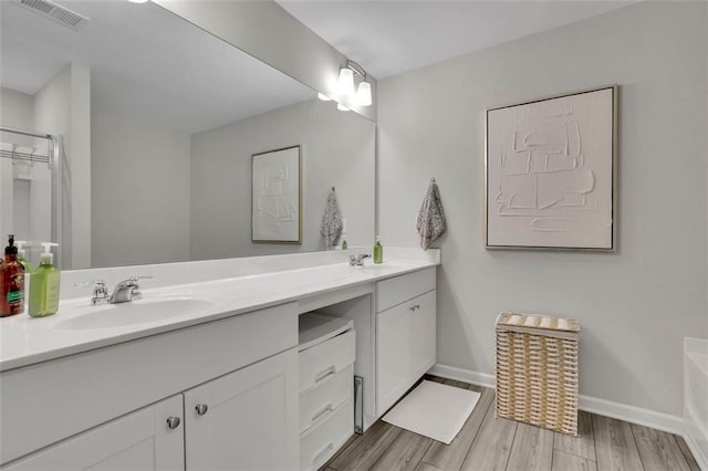 1969 Lanier Harbor Pt, Buford, GA 30518 - full bath featuring double vanity and wood finished floors