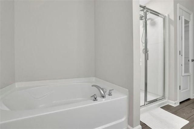 1969 Lanier Harbor Pt, Buford, GA 30518 - bathroom with a bath, a shower stall, and wood finished floors