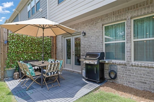 1969 Lanier Harbor Pt, Buford, GA 30518 - view of patio / terrace with area for grilling, french doors, and outdoor dining area
