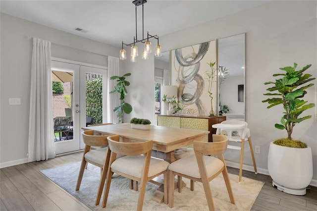 1969 Lanier Harbor Pt, Buford, GA 30518 - dining space featuring light wood-style floors and french doors