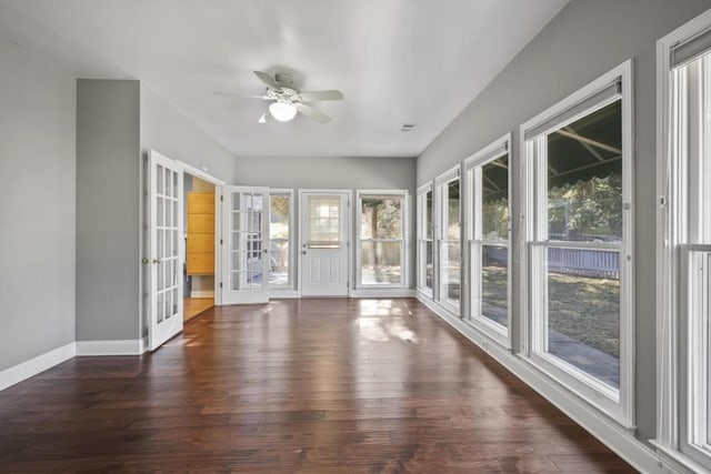 unfurnished sunroom with french doors and ceiling fan