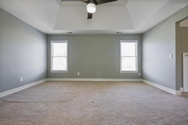 unfurnished room featuring a wealth of natural light, light colored carpet, and vaulted ceiling