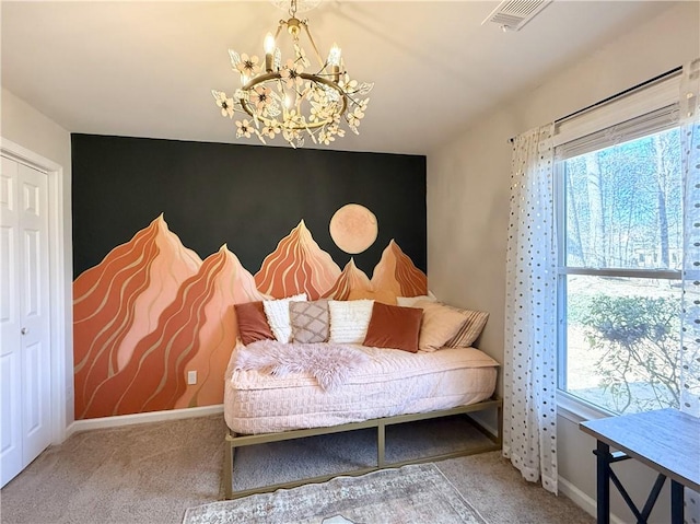 sitting room featuring baseboards, an accent wall, visible vents, and a chandelier