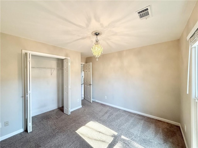 unfurnished bedroom featuring baseboards, visible vents, and a closet