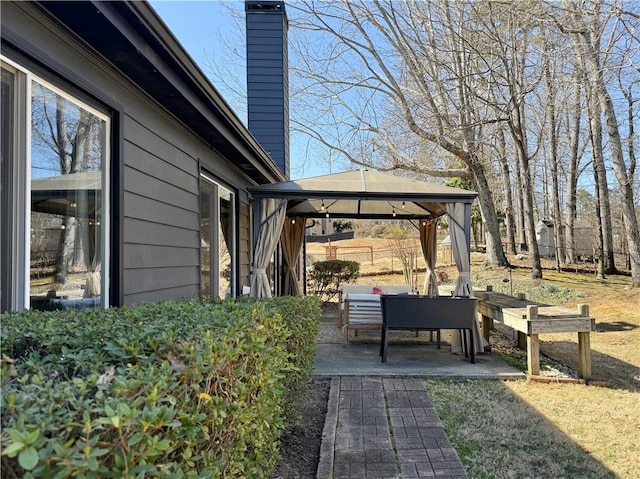 exterior space featuring a patio area and a gazebo