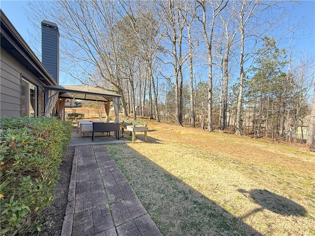 view of yard featuring a gazebo and a patio area