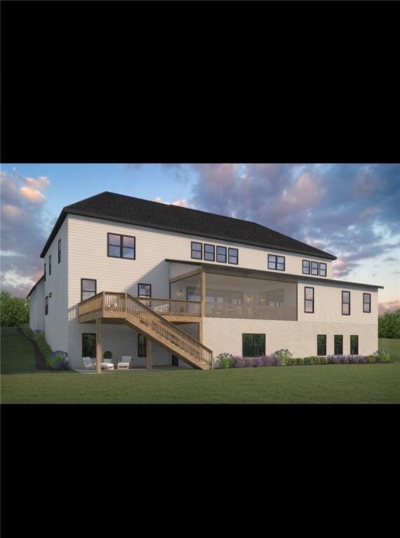 back of property at dusk with stairway, a deck, and a lawn